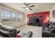 Spacious living room with a fireplace and large windows at 7112 E 131St Pl, Thornton, CO 80602