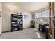 Home office with built-in shelving and a desk at 7112 E 131St Pl, Thornton, CO 80602