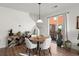 Stylish dining room with modern table and access to outdoor patio at 3061 Low Meadow Blvd, Castle Rock, CO 80109