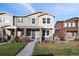 Charming two-story townhome with well-manicured lawn and inviting front porch, perfect for relaxing outdoors at 3061 Low Meadow Blvd, Castle Rock, CO 80109