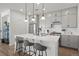Modern kitchen featuring white countertops, gray cabinets, stainless steel appliances, and breakfast bar seating at 3061 Low Meadow Blvd, Castle Rock, CO 80109