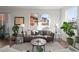 Cozy living room with hardwood floors, stylish sofa, neutral rug and lots of natural light at 3061 Low Meadow Blvd, Castle Rock, CO 80109