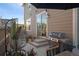 Back patio with a grill, egg chair, and a sliding glass door providing access to the home at 3061 Low Meadow Blvd, Castle Rock, CO 80109