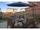 Patio with comfortable seating and a fire pit table for outdoor enjoyment and relaxation at 3061 Low Meadow Blvd, Castle Rock, CO 80109