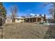 Expansive backyard featuring a covered patio, perfect for relaxing or entertaining guests at 10705 Downing St, Northglenn, CO 80233