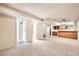 Unfinished basement with carpet and a built-in bar area with wood cabinets at 10705 Downing St, Northglenn, CO 80233