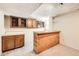 Basement bar area features cabinets, sink, and lots of counter space for entertaining at 10705 Downing St, Northglenn, CO 80233