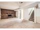 Basement featuring a brick fireplace and access to the stairs and another room at 10705 Downing St, Northglenn, CO 80233