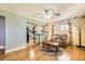 Comfortable living room with hardwood floors, ceiling fan, and an open view into the kitchen at 10705 Downing St, Northglenn, CO 80233