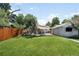 Spacious backyard with a well-manicured lawn and shaded seating area at 3055 S Bannock St, Englewood, CO 80110