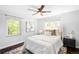 Calm bedroom features a neutral color palette and lots of natural light at 3055 S Bannock St, Englewood, CO 80110
