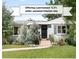 Charming exterior with well-maintained lawn and front yard landscaping at 3055 S Bannock St, Englewood, CO 80110
