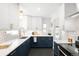 Modern kitchen featuring sleek cabinetry, countertops, and stainless steel appliances at 3055 S Bannock St, Englewood, CO 80110