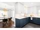 Stylish kitchen with two-tone cabinets, granite counters, and modern fixtures at 3055 S Bannock St, Englewood, CO 80110