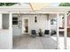 Back patio area with concrete flooring, an outdoor seating area, and access to the home at 3055 S Bannock St, Englewood, CO 80110