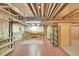 Spacious unfinished basement featuring open ceilings, functional utilities, and an abundance of potential storage at 4042 E Hinsdale Cir, Centennial, CO 80122