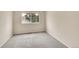 Cozy bedroom with neutral carpet and a large window allowing ample natural light to illuminate the space at 4042 E Hinsdale Cir, Centennial, CO 80122