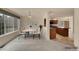 Bright dining room with large windows and seamless access to the kitchen area at 4042 E Hinsdale Cir, Centennial, CO 80122