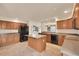 Open kitchen with an island, stainless steel sink, and plenty of cabinet space at 4042 E Hinsdale Cir, Centennial, CO 80122
