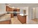 Spacious kitchen with an island, tile floors, stainless steel appliances, and lots of cabinet space at 4042 E Hinsdale Cir, Centennial, CO 80122