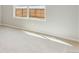 Cozy bedroom with neutral carpet, window with blinds and natural light at 48215 Shetland Dr, Bennett, CO 80102