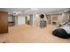 Finished basement with a rec area, open space, and access to the stairs at 5224 Snow Goose St, Brighton, CO 80601