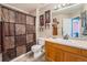 The bathroom includes fun animal print decor and a convenient shower curtain, creating a whimsical space at 5224 Snow Goose St, Brighton, CO 80601