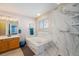 Bright bathroom features a large soaking tub, walk-in shower, and a spacious vanity at 5224 Snow Goose St, Brighton, CO 80601