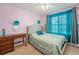 Cozy bedroom with a decorative bed, desk, and sheer curtains that add a soft touch at 5224 Snow Goose St, Brighton, CO 80601