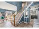 Inviting foyer with staircase and neutral tile flooring at 5224 Snow Goose St, Brighton, CO 80601