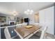 Open concept eat-in kitchen, with access to living room, offering a fireplace, built-ins, and a comfortable living space at 5224 Snow Goose St, Brighton, CO 80601