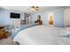 Serene primary bedroom with lots of natural light, light blue walls, and walk-in closet at 5224 Snow Goose St, Brighton, CO 80601