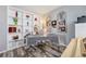 A cozy home office with custom shelving, a unique desk, and stylish decor, perfect for working from home at 5224 Snow Goose St, Brighton, CO 80601