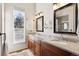 Elegant bathroom with double sinks, granite countertops, and a large window at 1337 N Ford St, Golden, CO 80403