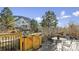 Spacious deck with mountain views, table and chairs, and wooden gate at 1337 N Ford St, Golden, CO 80403