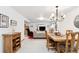 Bright dining area with a rustic wooden table and access to the living room at 1337 N Ford St, Golden, CO 80403