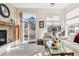 Living room with fireplace and sliding glass doors to deck at 1337 N Ford St, Golden, CO 80403