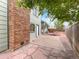The backyard has a brick chimney and a concrete patio that is surrounded by beautiful landscaping at 1460 Belmont Dr, Longmont, CO 80503