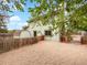 Home's backyard features a fenced yard with a small shed under a sunny blue sky with white clouds at 1460 Belmont Dr, Longmont, CO 80503