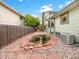 A tranquil backyard features a pond with a stone border and a wooden fence at 1460 Belmont Dr, Longmont, CO 80503