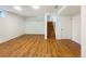 Basement featuring laminate flooring and stairs to the floor above at 1460 Belmont Dr, Longmont, CO 80503
