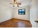 Bedroom featuring laminate floors, a ceiling fan, and closet at 1460 Belmont Dr, Longmont, CO 80503