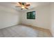 Bright bedroom featuring tile floor, a ceiling fan, and a window at 1460 Belmont Dr, Longmont, CO 80503
