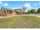 Well maintained home with a lush lawn, brick facade, and two car garage at 1460 Belmont Dr, Longmont, CO 80503