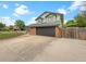 A well-kept home with a gray two-car garage and a concrete driveway at 1460 Belmont Dr, Longmont, CO 80503