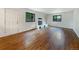 Bright living room features a fireplace, large windows, and hardwood floors at 1460 Belmont Dr, Longmont, CO 80503