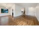 The living room features hardwood floors, white walls, and a view of the staircase at 1460 Belmont Dr, Longmont, CO 80503