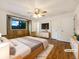 Comfortable main bedroom featuring hardwood floors, a decorative window, and ample closet space at 1460 Belmont Dr, Longmont, CO 80503