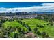 Aerial view of the neighborhood showcasing green spaces and city views at 7375 E Quincy Ave # 204, Denver, CO 80237