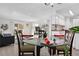 Dining area with glass table and four chairs, and chandelier at 7375 E Quincy Ave # 204, Denver, CO 80237